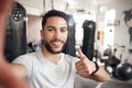 Man, portrait and selfie at a gym for fitness with thumbs up for wellness or health in a close up. Male person, selfies