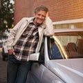 Man, portrait and smile at car in city for relax road trip or weekend commute, downtown or urban. Mature, male person