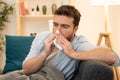 Man portrait suffering cold and flu at home Royalty Free Stock Photo