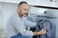 Man portrait thinking about washing machine Royalty Free Stock Photo