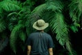 A man poses in one of the forests in Magetan with his back to the camera Royalty Free Stock Photo