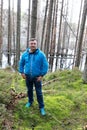 Man posing on background of flooded lake