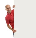 Man posing behind a billboard Royalty Free Stock Photo