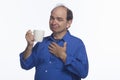 Man posing with coffee mug, horizontal