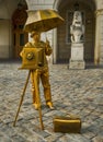 Man posing in colored clothing and decorative camera