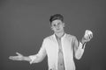 Man posing with cup in open shirt with muscular torso Royalty Free Stock Photo