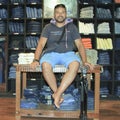 Man posing in denim jeans shop