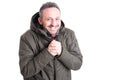 Man posing like being cold wearing winter casual clothes Royalty Free Stock Photo