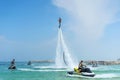 Man posing at new flyboard at Caribbean tropical beach. Positive Royalty Free Stock Photo