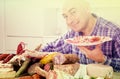 Man posing with a plate of cold cuts Royalty Free Stock Photo