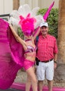 Man posing with showgirl