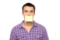 Man with post it on lips Royalty Free Stock Photo