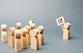 A man with a poster agitates a group of people. Agitation, referendum, poll. Voting in a democratic election. Voters, the Royalty Free Stock Photo