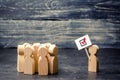 A man with a poster agitates a group of people. Voters, the political process. Political movement, faction, party. Agitation Royalty Free Stock Photo