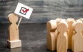 A man with a poster agitates a group of people. Voters, the political process. Political movement, faction, party. Agitation, Royalty Free Stock Photo