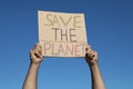 Man with poster protesting against climate change outdoors, closeup Royalty Free Stock Photo