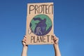 Man with poster protesting against climate change outdoors, closeup Royalty Free Stock Photo