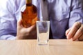 Man pouring alcohol into the glass