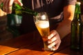 Man Pouring beer into glass. background object alcohol, oktoberfest concept Royalty Free Stock Photo