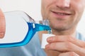 Man Pouring Bottle Of Mouthwash Into Cap Royalty Free Stock Photo