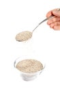 Man Holding a Spoonful of Chia Seeds