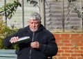 Man pouring drink from a vacuum flask.