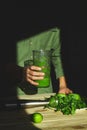 Man pouring in glass healthy detox smoothie, cooking with blender with fresh fruits and greens spinach at home, Lifestyle detox c