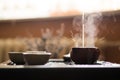 Pouring of Puer Tea from Teapot at Traditional Chinese Tea Ceremony. Set of Equipment for Drinking Tea