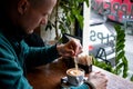 Man pouring sugar in a cup of coffee. Royalty Free Stock Photo