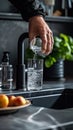 Man Pouring Water Into Glass Royalty Free Stock Photo