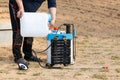 pouring weed killer on crop duster