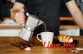 A man pours coffee in a mug with nightingales I LOVE YOU Royalty Free Stock Photo