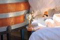 Man pours honey from the barrel