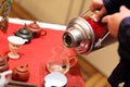 Man pours water into jug