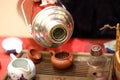 Man pours water into teapot