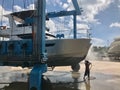 Man power washing boat