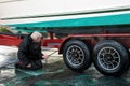 Man Power Washing Boat on Trailer Royalty Free Stock Photo