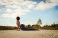 Man practices asanas on yoga in harmony with nature