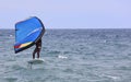 the man practices windfoil, kite, board and wetsuit, in the sea, Royalty Free Stock Photo
