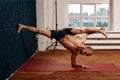 Man practicing advanced yoga against a urban background Royalty Free Stock Photo