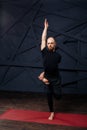 Man practicing advanced yoga against a urban background Royalty Free Stock Photo