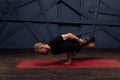 Man practicing advanced yoga against a urban background Royalty Free Stock Photo