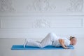 Man practicing advanced yoga against a white background Royalty Free Stock Photo