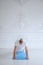 Man practicing advanced yoga against a white background Royalty Free Stock Photo