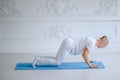 Man practicing advanced yoga against a white background Royalty Free Stock Photo