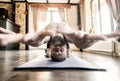 Man practicing complicated yoga asana