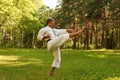 The man practicing karate in the park Royalty Free Stock Photo