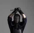 Man is practicing kendo in traditional armor .He swinging with bamboo sword Royalty Free Stock Photo