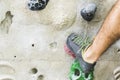 Man practicing rock climbing on artificial wall indoors. Active Royalty Free Stock Photo