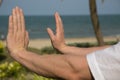 Man practicing tai chi by the sea Royalty Free Stock Photo